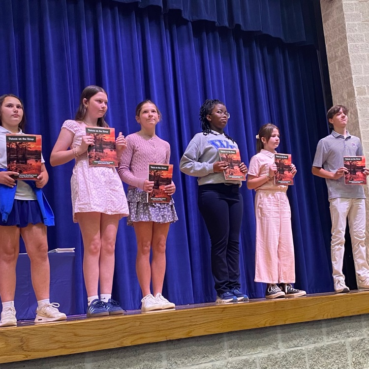 winners of the young authors contest take the stage