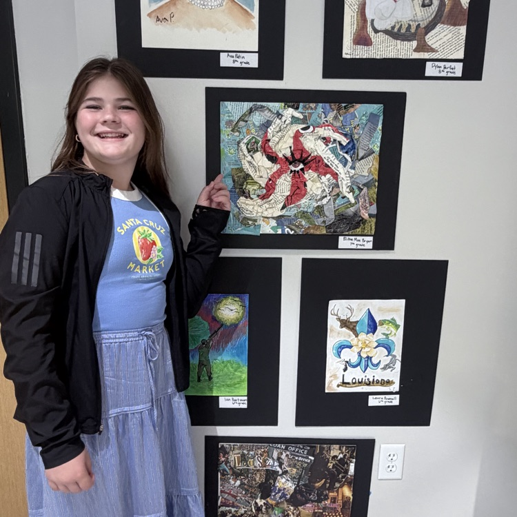 student shows off her artwork
