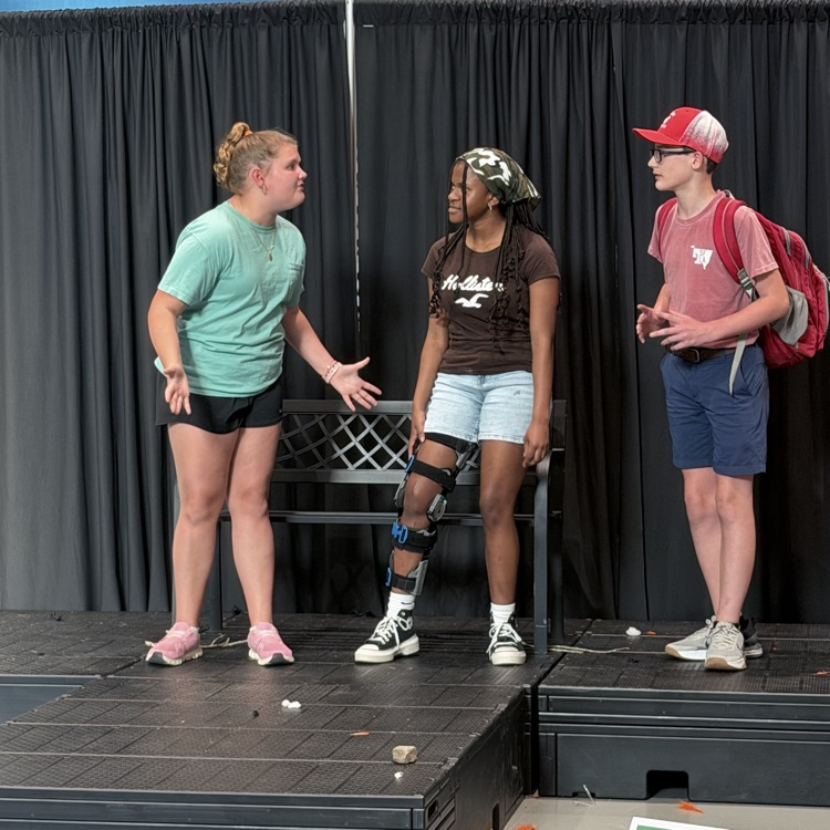 students featured on stage