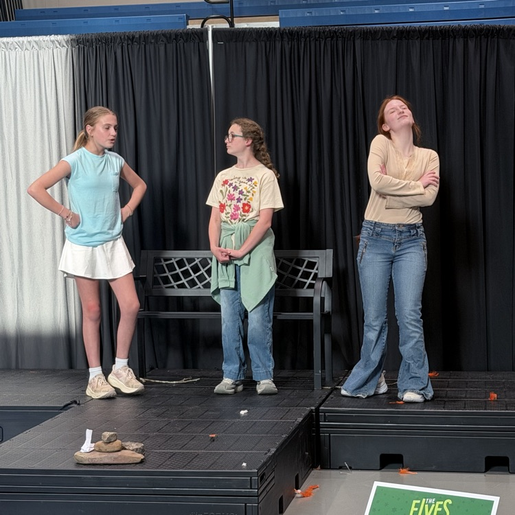 students featured on stage