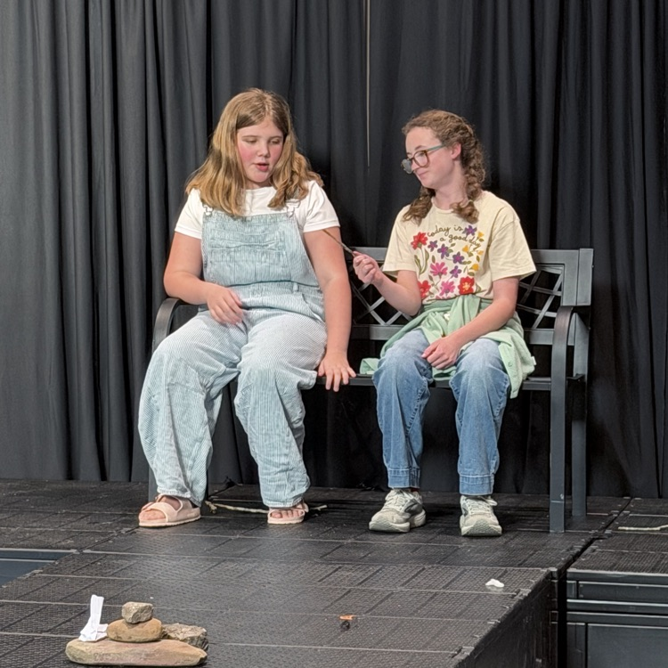 students featured on stage