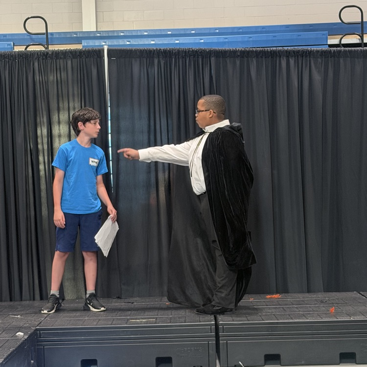 students featured on stage