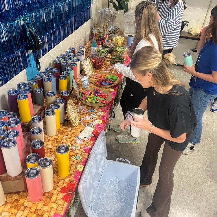 Teacher select a water bottle