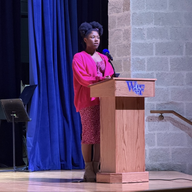 student speaks at podium 