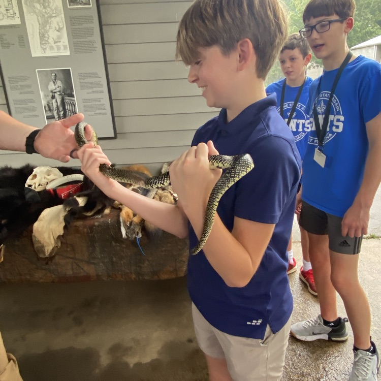 students pictured with snake