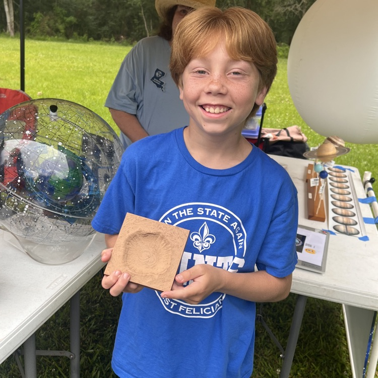 student displays artwork