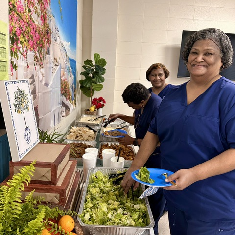 staff enjoy a meal