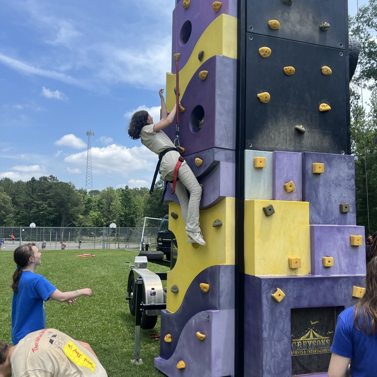 student on rock climbing wall