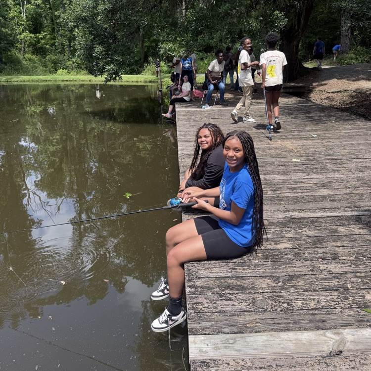 students fishing on dock