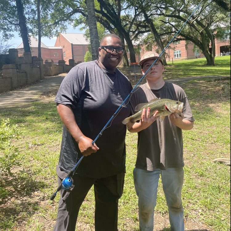 teacher and student catch a fish
