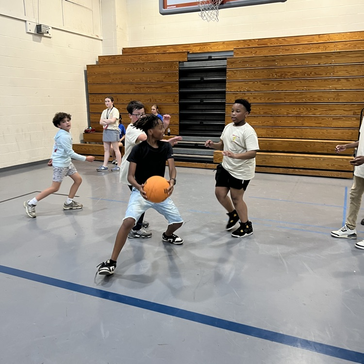students play basketball