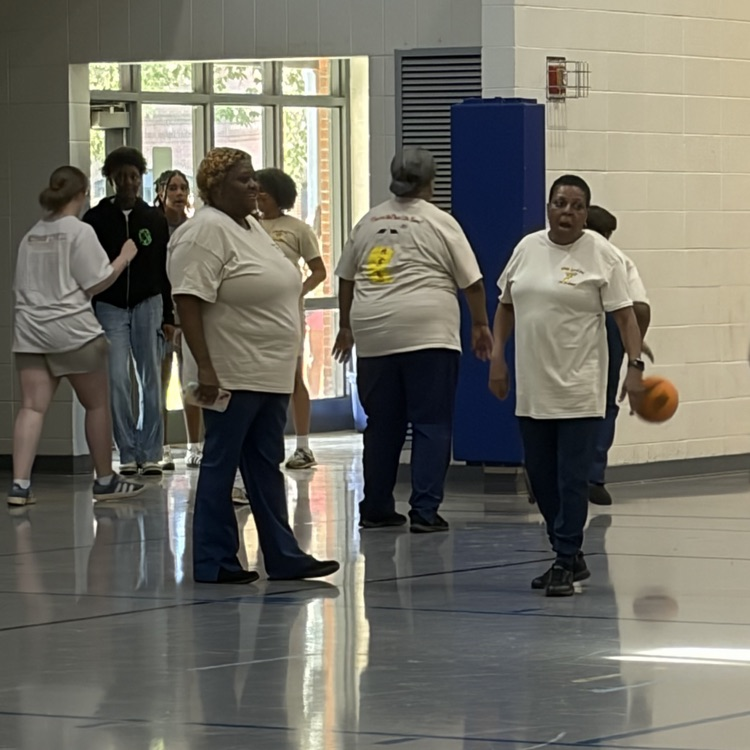 cafeteria staff plays basketball with students