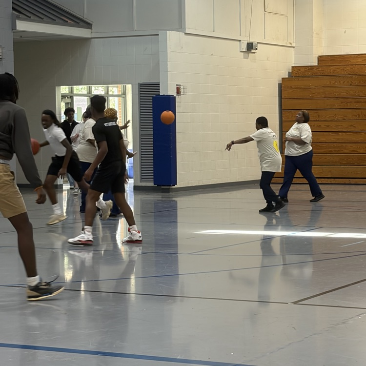 cafeteria staff plays basketball with students