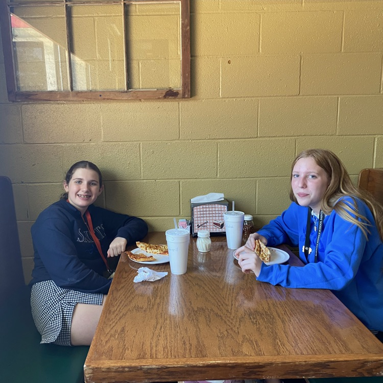 students eat pizza for lunch 