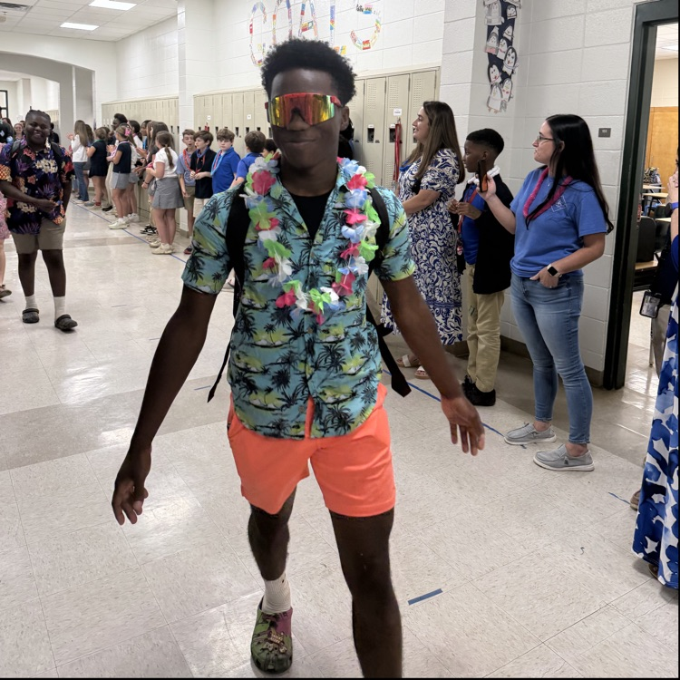 eighth graders walk down the whole way to applause and Cheer