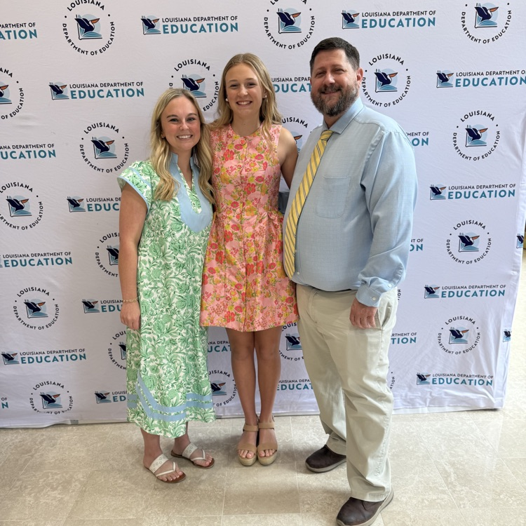 betsy, Kate pictured with a teacher and principal