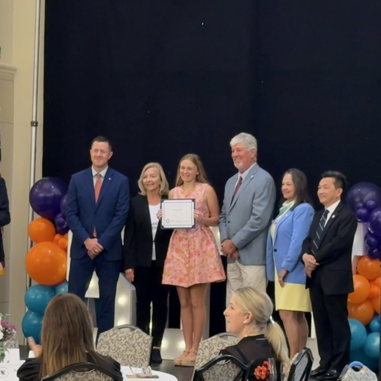 betsy Kate receives award on stage