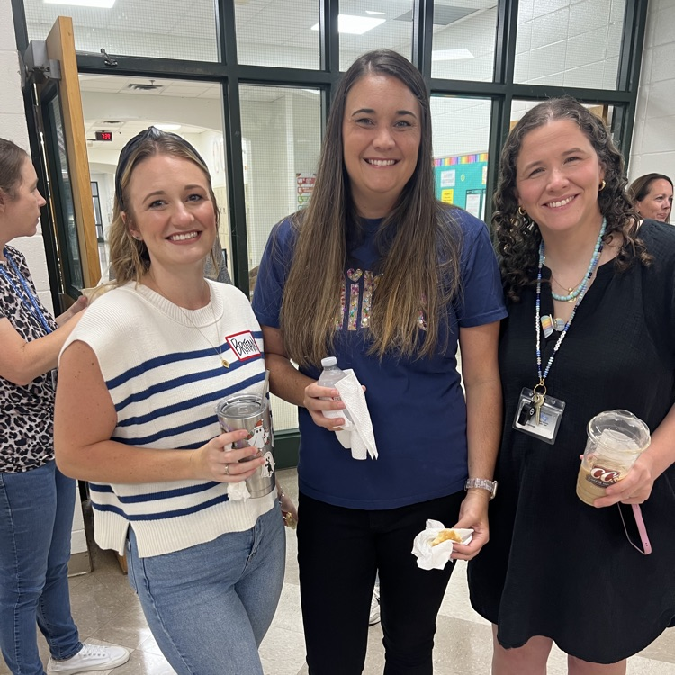 Staff members visit over breakfast