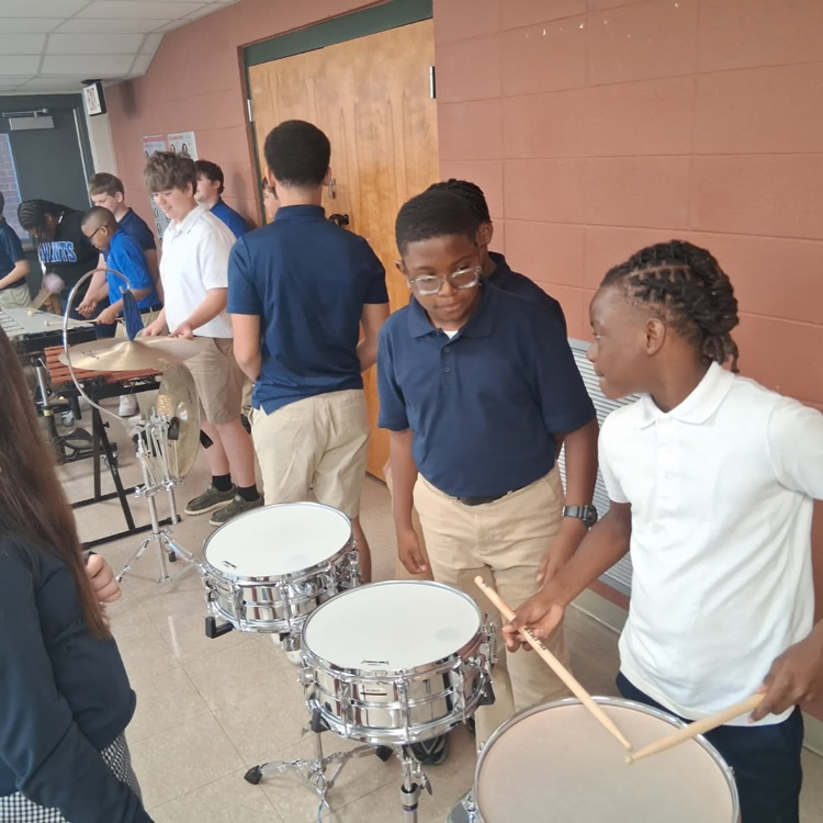 students play drums
