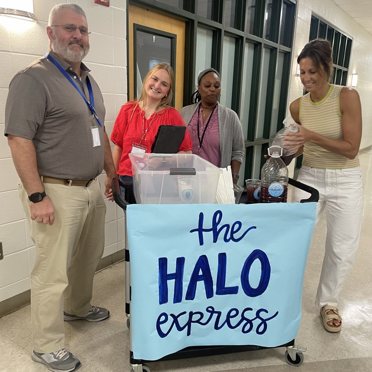 Teachers grab a tea from the halo express cart