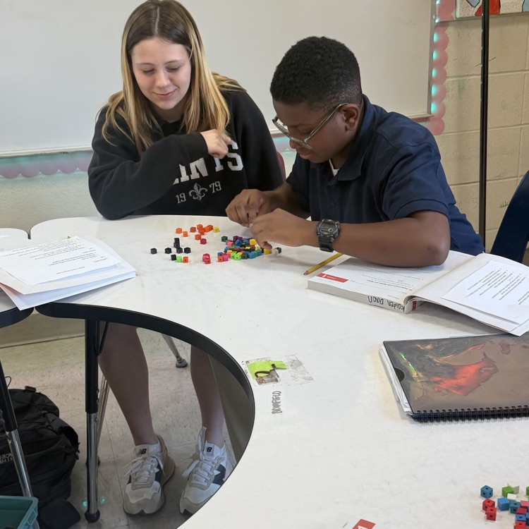 students work with math manipulatives