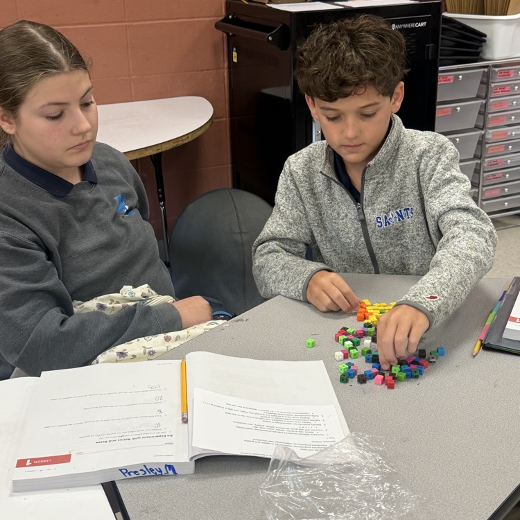students work with math manipulatives