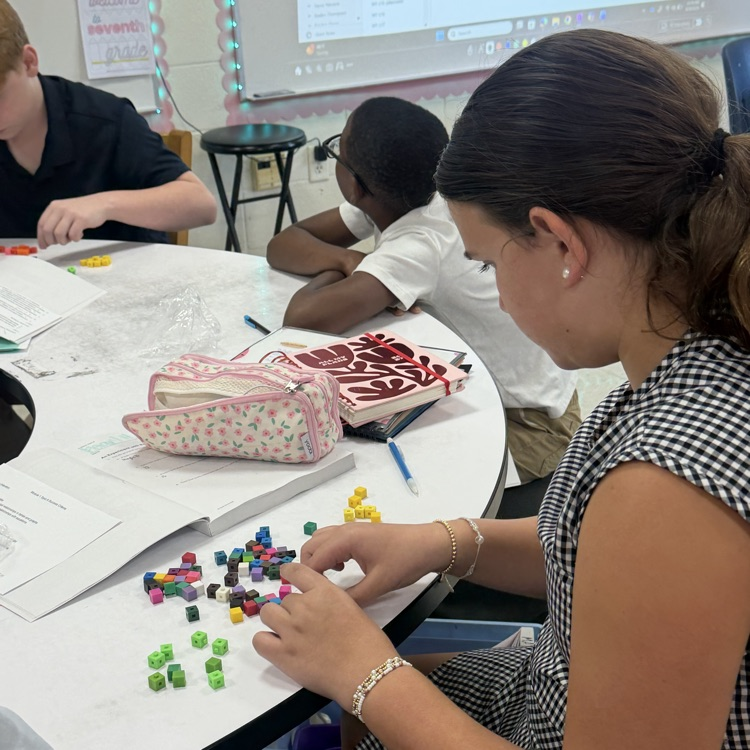 students work with math manipulatives