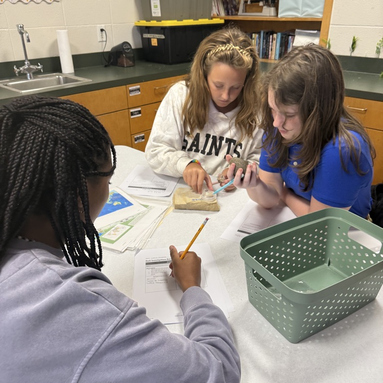 students study properties of rocks