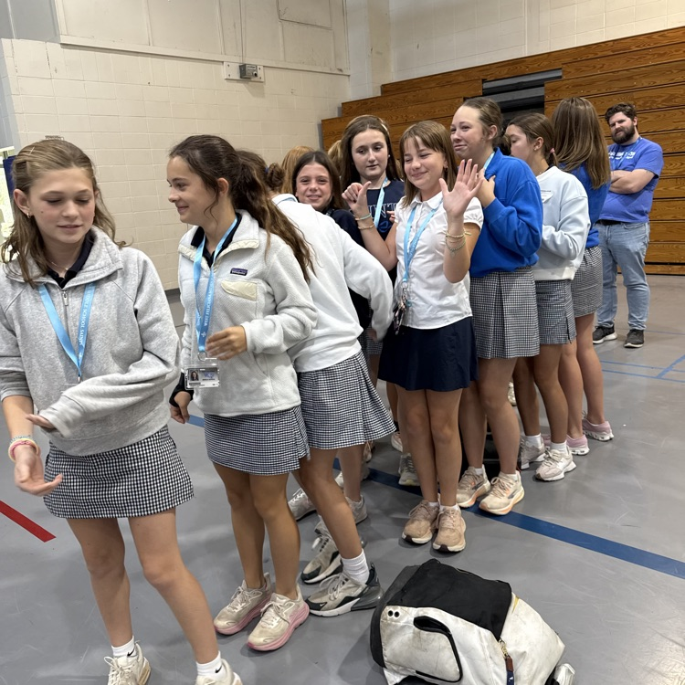 girls line in the gym waiting for a game