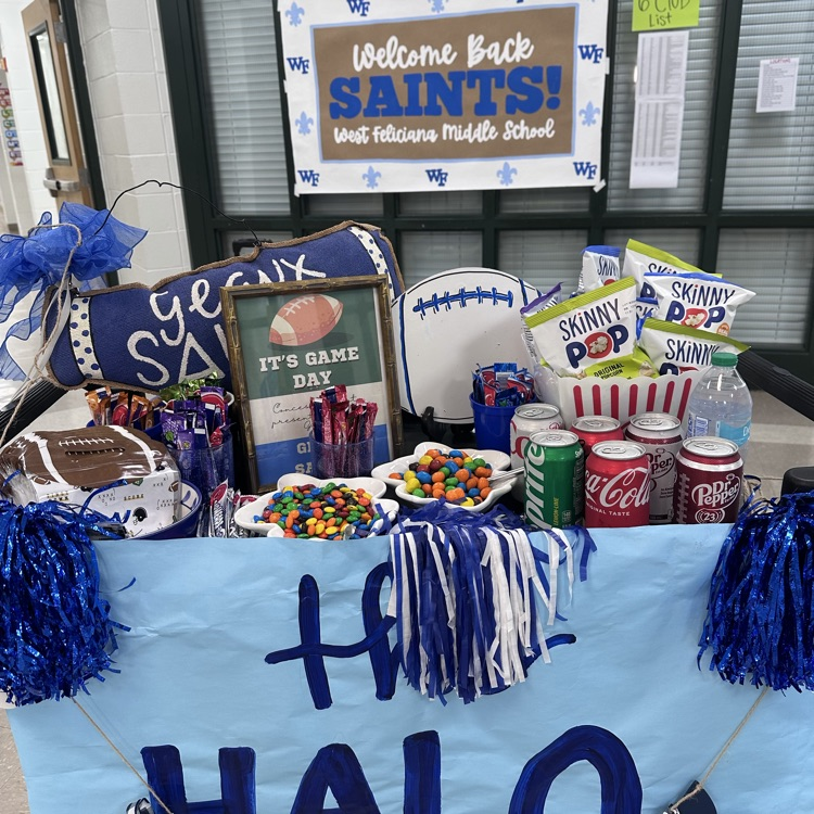 display includes candy, popcorn, drinks, football-themed decorations, pom-poms, fleur-de-lis accents