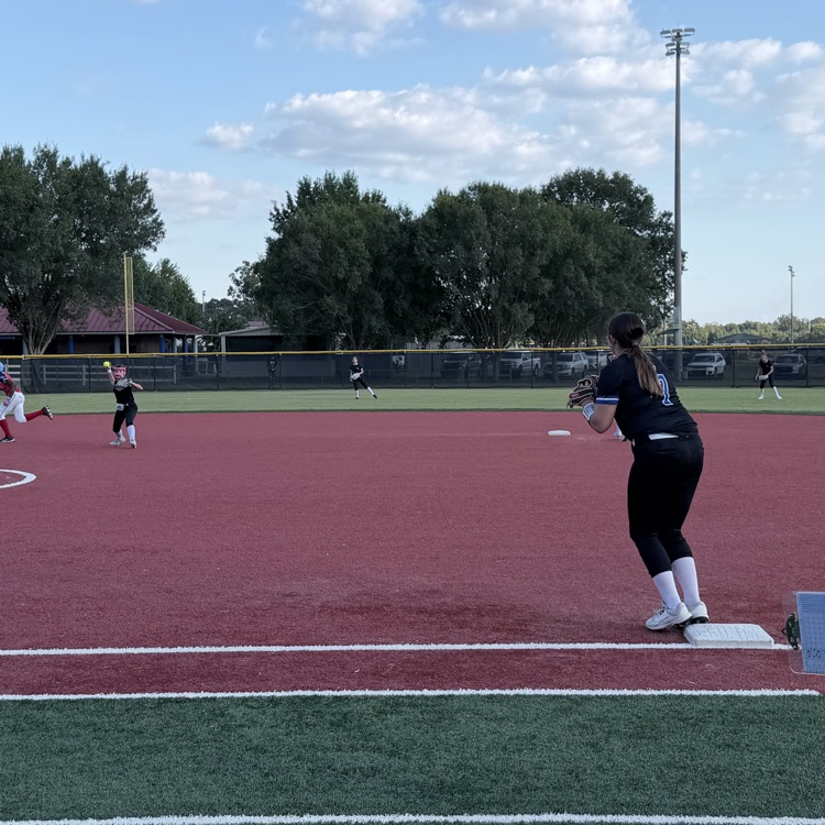 girl throws ball to 1st base