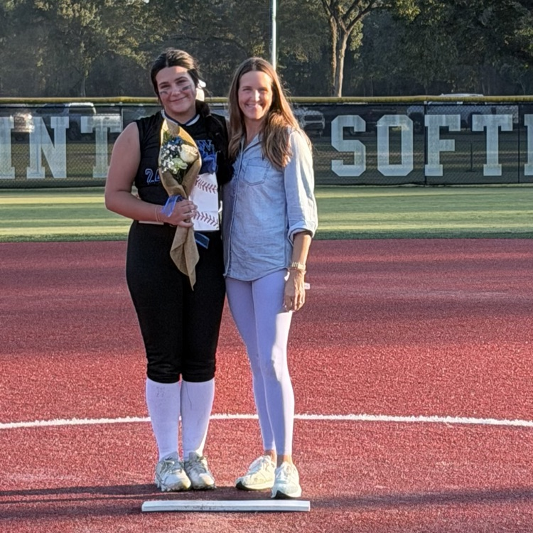 8th grade player poses with parent for last home game 