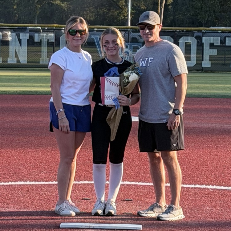 8th grade player poses with parent for last home game 