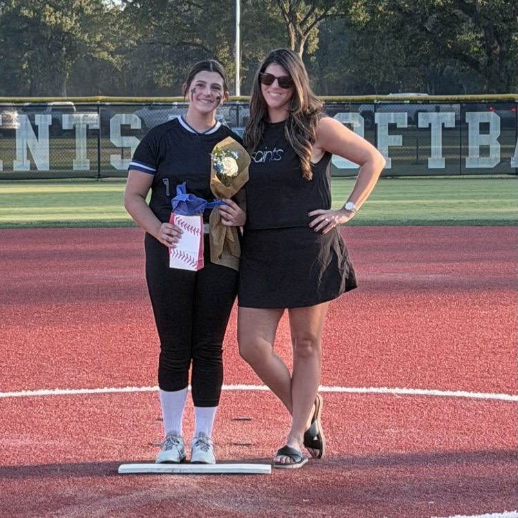 8th grade player poses with parent for last home game 