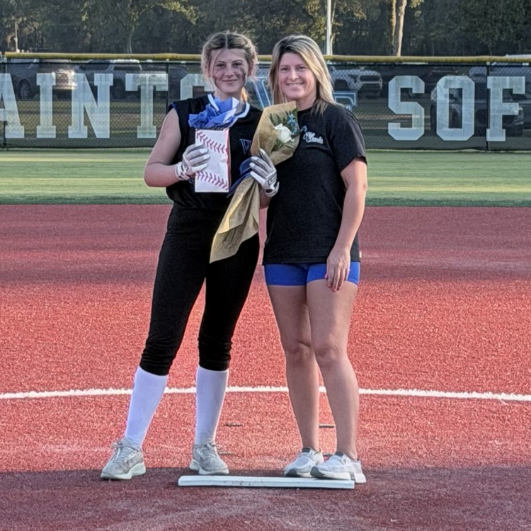8th grade player poses with parent for last home game 