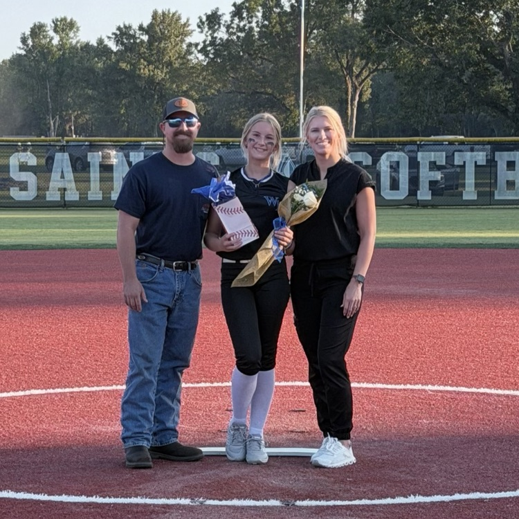 8th grade player poses with parent for last home game 