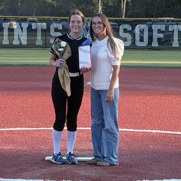 8th grade player poses with parent for last home game 