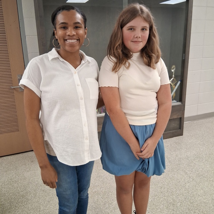 Ms. Anthony stands with Stella