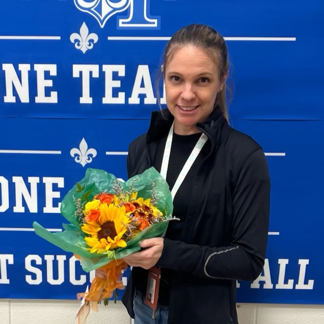 Ms. Woodman pictured with flowers