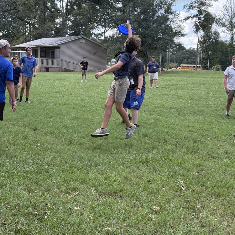 student catches frisbee