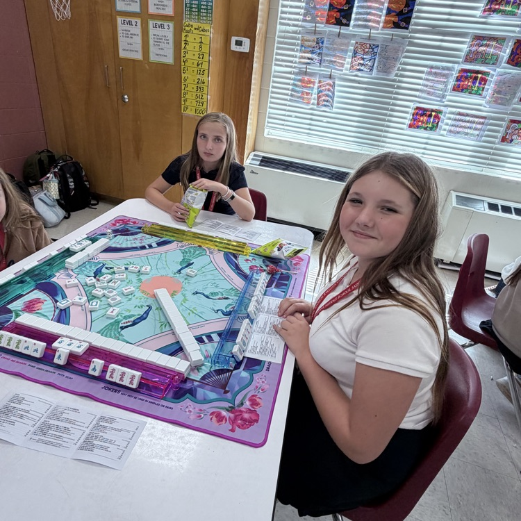 students play Mahjong