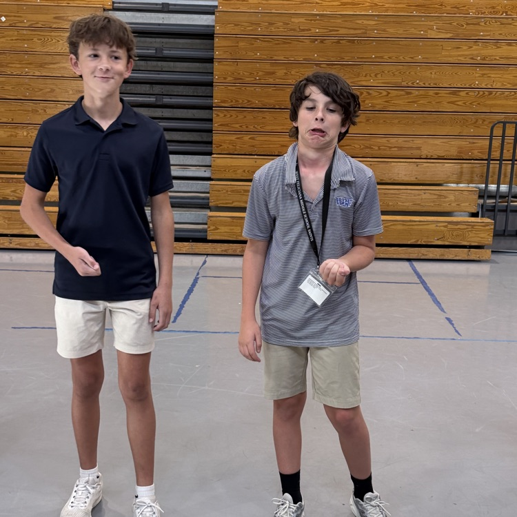 student laughs as another students grimaces in disgust
