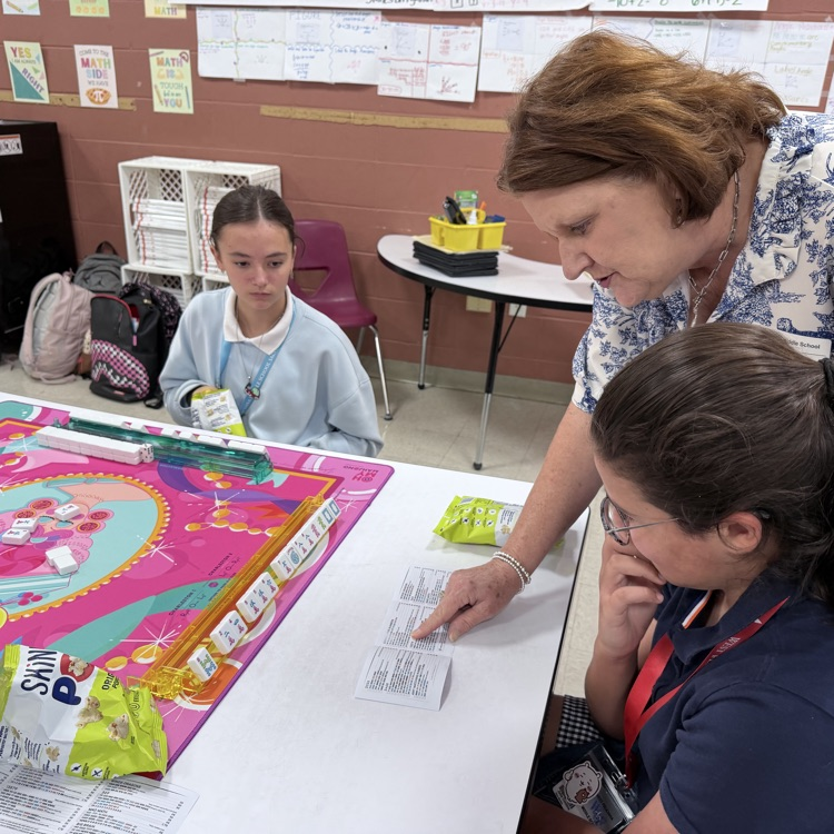 students play a game of mahjong