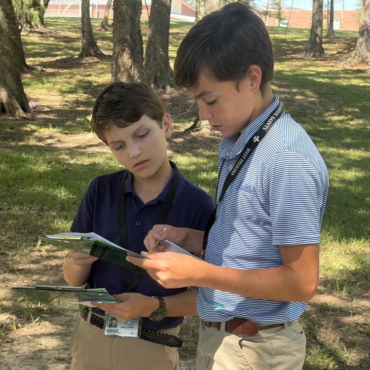 Students collaborate to solve an escape room challenge.