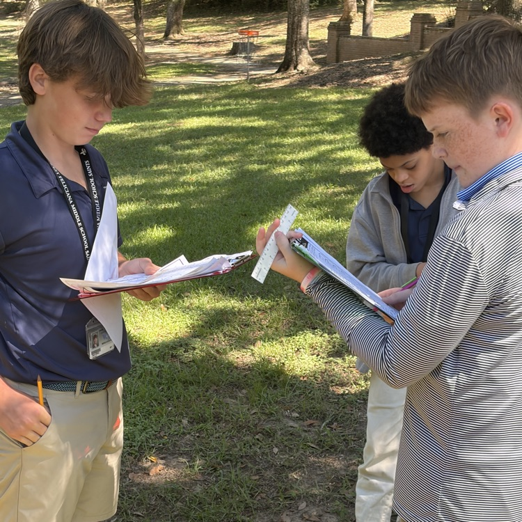 Students collaborate to solve an escape room challenge.