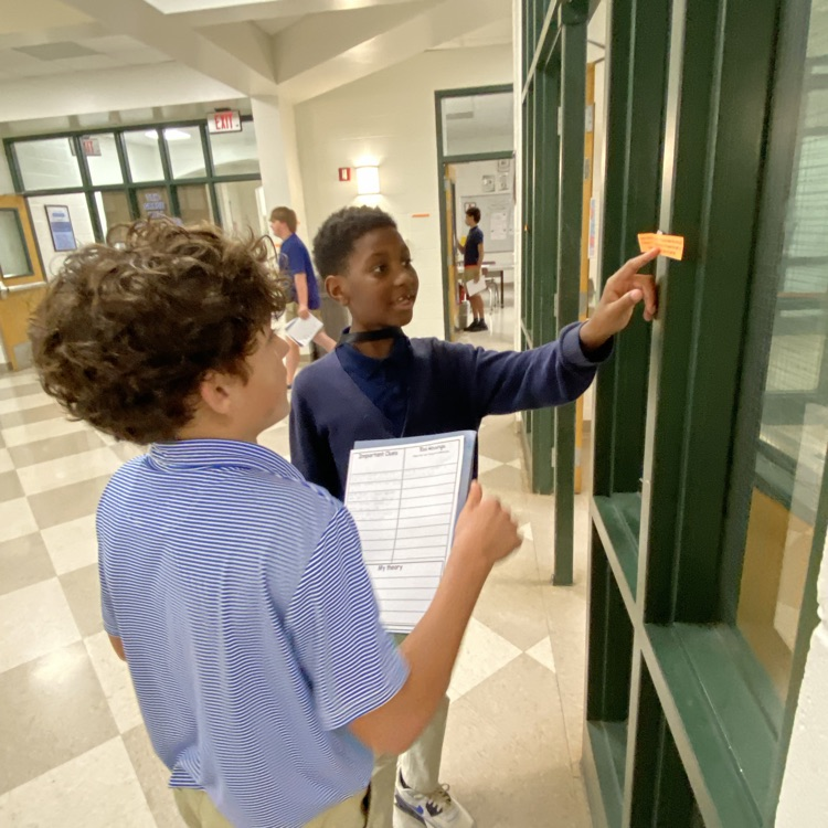 Students collaborate to solve a puzzle