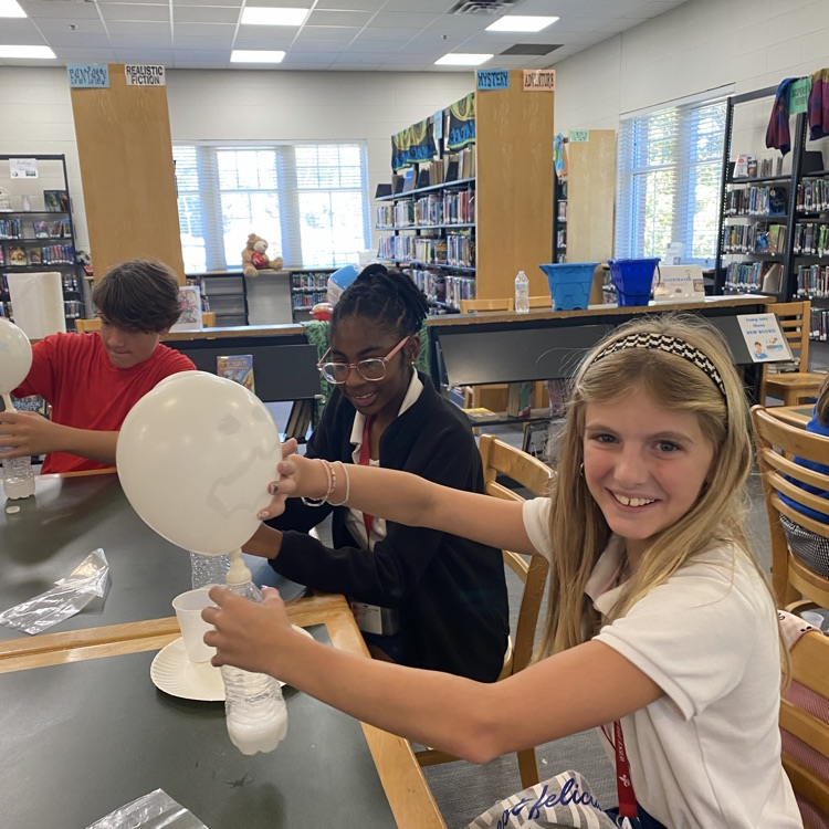 Student plays with balloon
