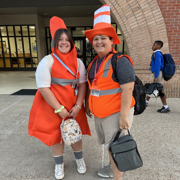 Students dress as construction workers and traffics cones in celebration of pit crew day for homecoming week
