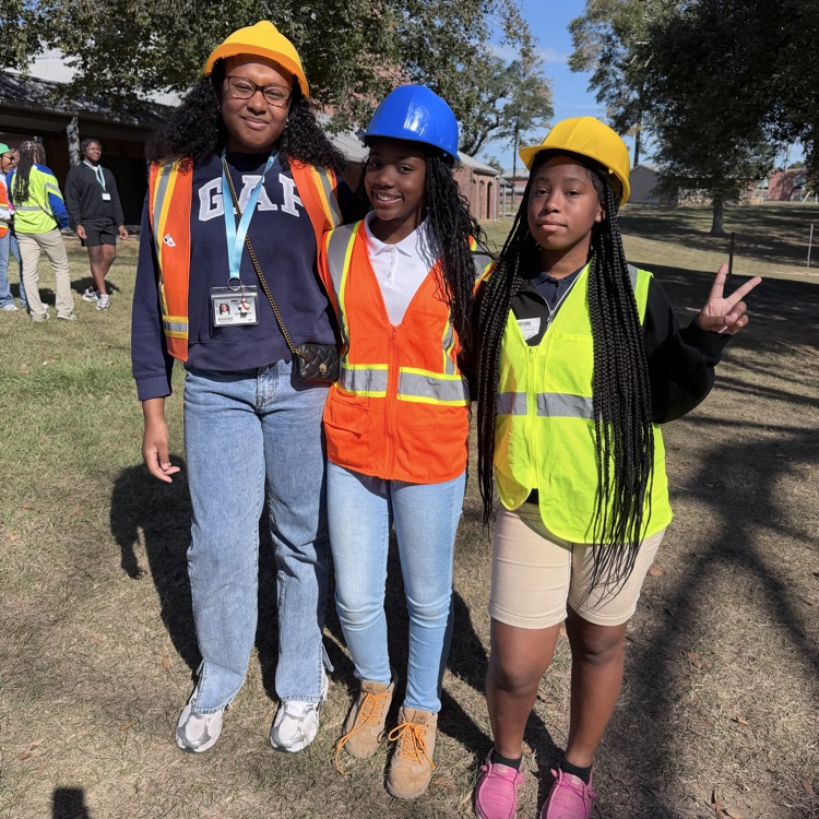 Students dress as construction workers and traffics cones in celebration of pit crew day for homecoming week