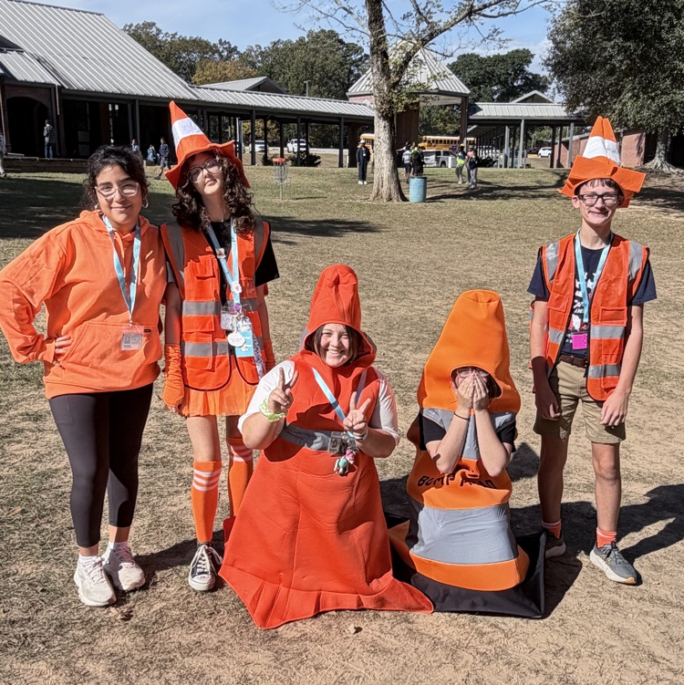 Students dress as construction workers and traffics cones in celebration of pit crew day for homecoming week